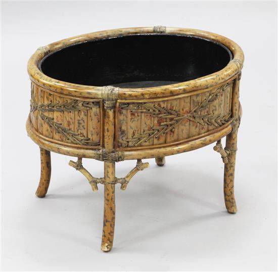 An early 20th century bamboo jardiniere, W.1ft 2in. D.1ft 6in. H.1ft 4in.